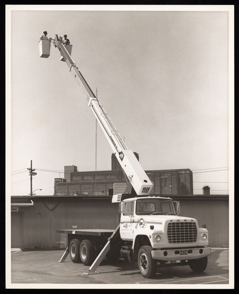 electrical workers on truck lift