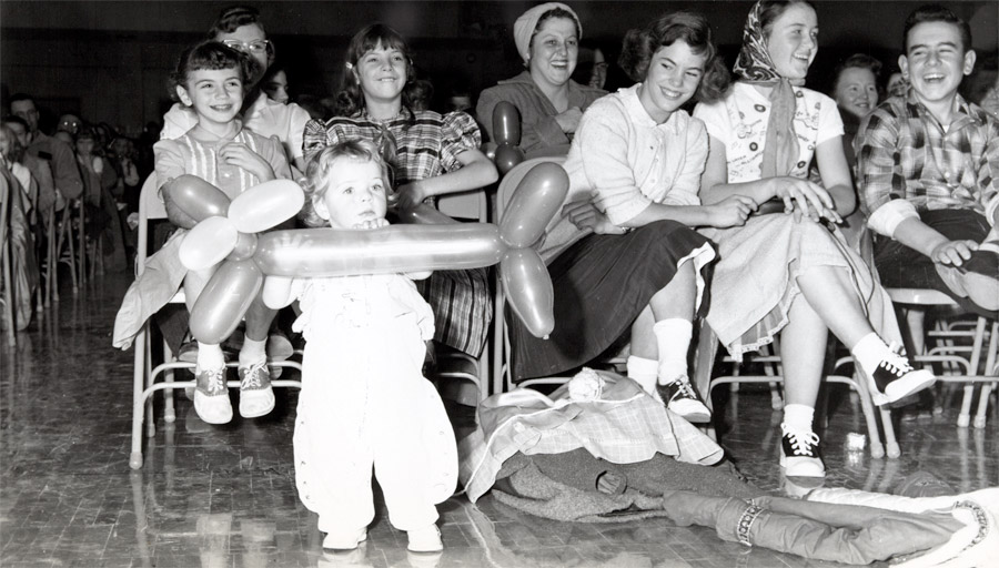 Photo of child holding balloon